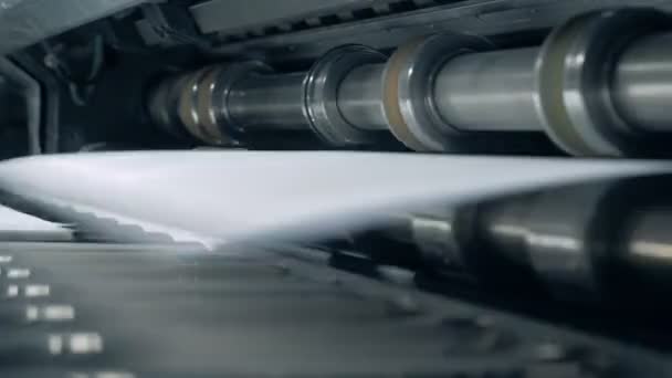 Close up of a roller mechanism issuing paper — Stock Video