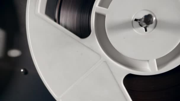 Close up of a reel with tape slowly rotating — Stock Video