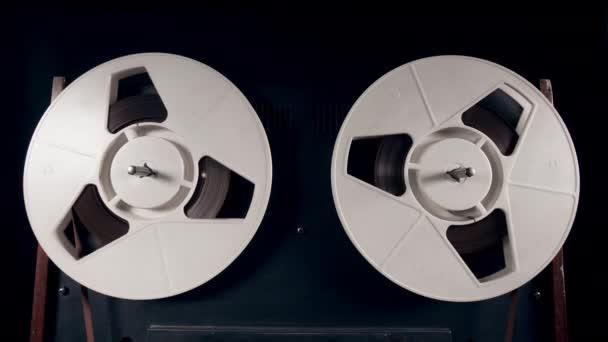 Reels are slowly spinning with tape on them — Stock Video