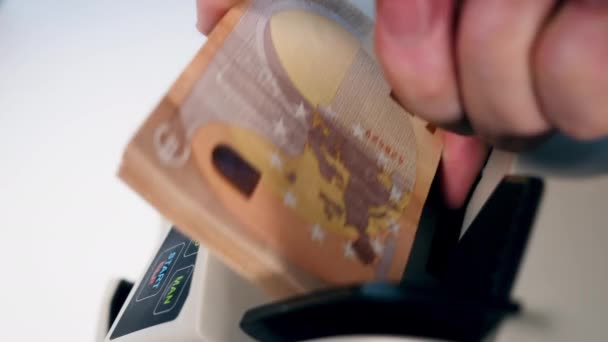 Euro money are getting put into the calculating device — Stockvideo