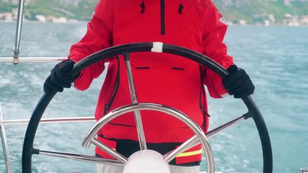 Steering wheel of a yacht is being controlled by a person — Stock Video