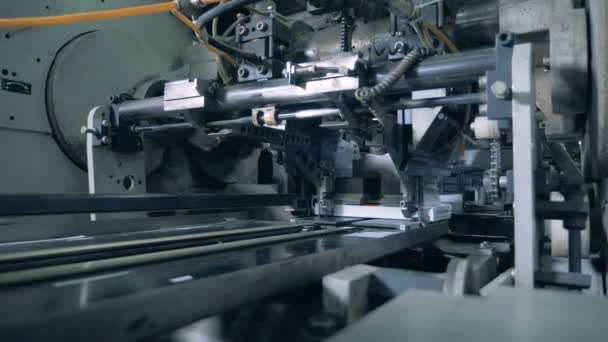 Industrial machine moving books, typographical equipment. — Stock Video