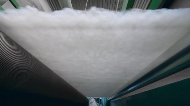 Polyester batting rolled on a factory conveyor. — Stock Video