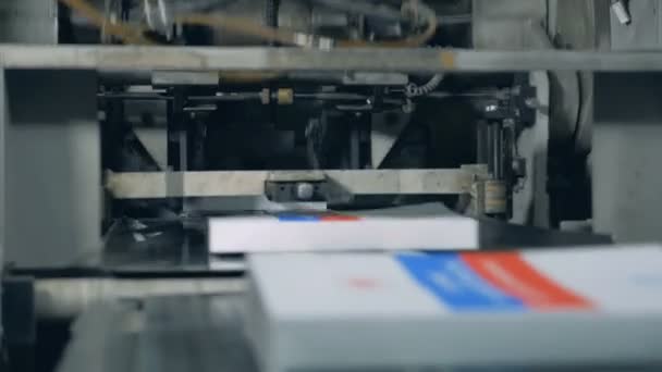 Printed books are getting issued by the press — Stock Video