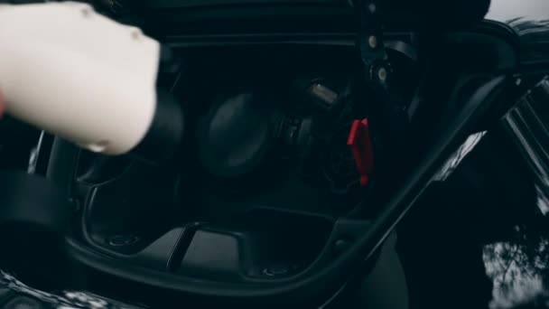 Electromobile owner plugs a charger to a socket. Innovative electric hybrid car charging. — Stock Video