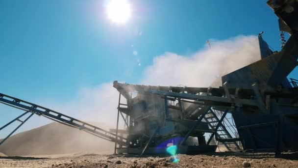 Industrial site with rubble getting processed. Aerial view of mining quarry. — Stock Video