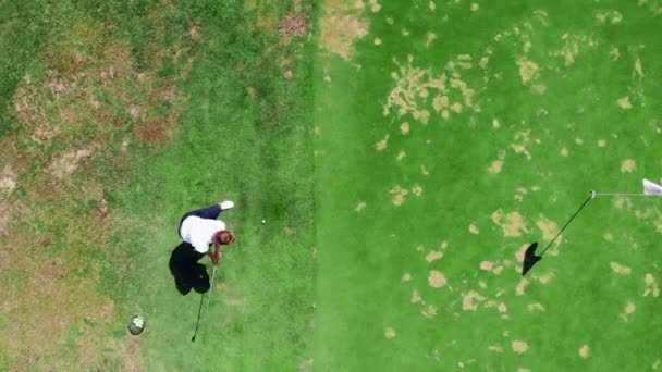 stock video Top view of a golf strike made by the male golfer