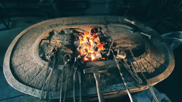 Blacksmithing tools on an anvil. — Stock Video
