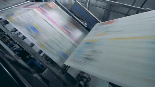 Printed paper is rolling through the printing machine. Fake news concept. — Stock Video