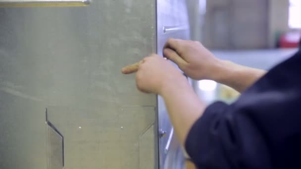 Unrecognizable employee put the screws in holes, screwing, tightening by hand. — Stock Video