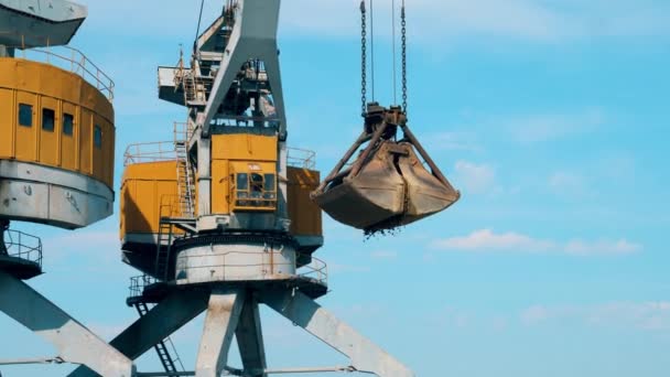 Gravel is getting poured from the bucket of a loader — Stock Video