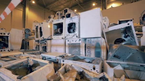 Discarded washing machines at a garbage recycling factory. Recycle process, secondary use of plastic. — Stock Video