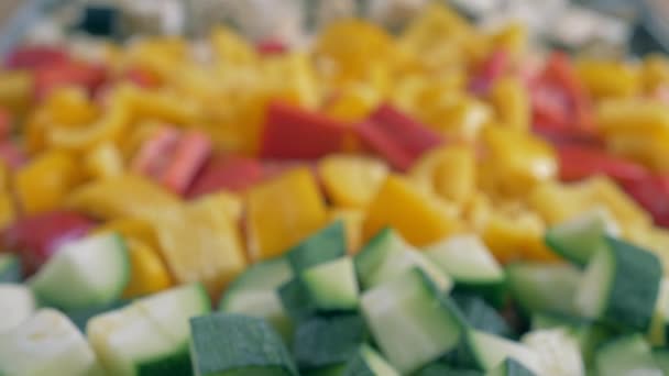 Diced green zucchini near bell pepper. — Stock Video