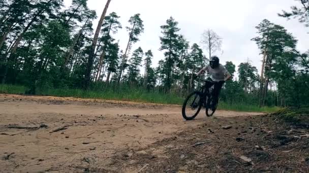 Cyclist is riding along the track on a sports bike — Stock Video