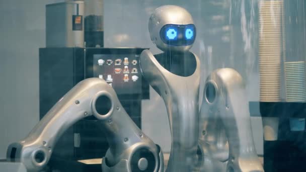 High-tech cyborg is working in a coffee house — Stock Video