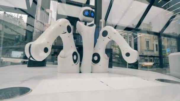 Futuristic robot, innovative technology concept. Coffee-serving robot is moving its arms while working — Stock Video