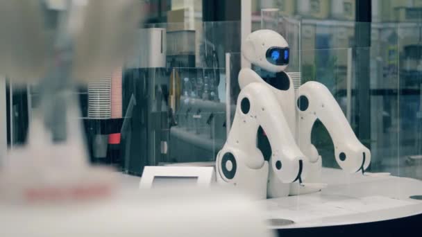 Mechanical cyborg is waiting for orders in a cafe. Futuristic robot, innovative technology concept. — Stock Video