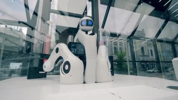 Innovation, modern technology concept. High-tech droid is moving its arms in a coffee house — Stock Video