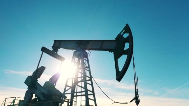 Silhouette of a working oil pump jack — Stock Video