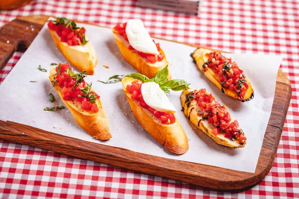 Traditional Italian Bruschetta Cherry Tomatoes Basil Mozzarella Cheese Wooden Cutting — Stock Photo, Image