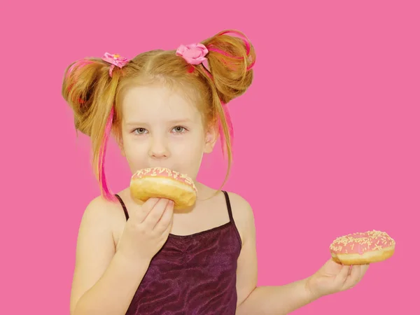 Little Happy Cute Girl Eating Donut Pink Background Wall Child — Stock Photo, Image