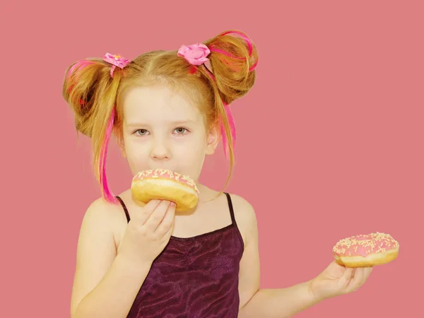 Little Happy Cute Girl Eating Donut Pink Background Wall Child — Stock Photo, Image