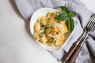 Cauliflower casserole with cheese in a cream sauce. Cauliflower gratin with bechamel sauce/