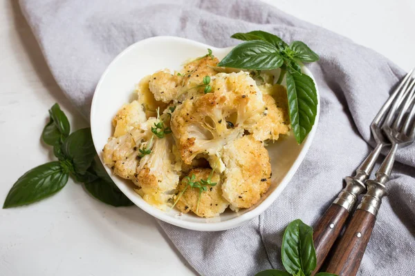 Cauliflower casserole with cheese in a cream sauce. Cauliflower gratin with bechamel sauce/