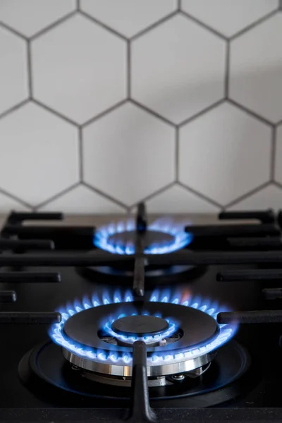 Gas burner on black modern kitchen stove. kitchen gas