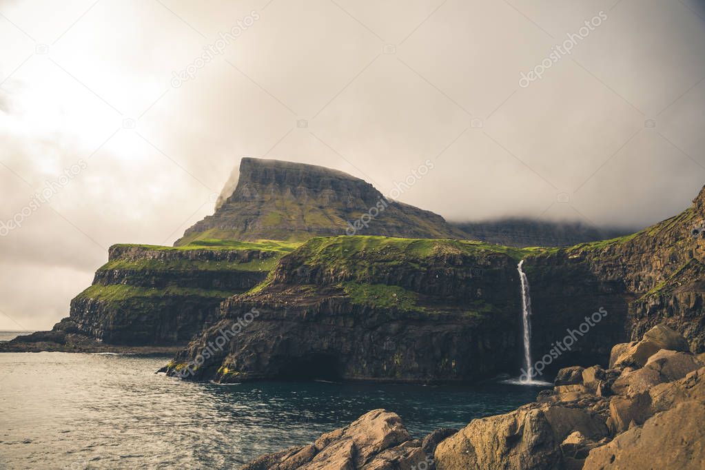 Gasadalur village and Beautiful waterfall. Vagar, Faroe Islands,