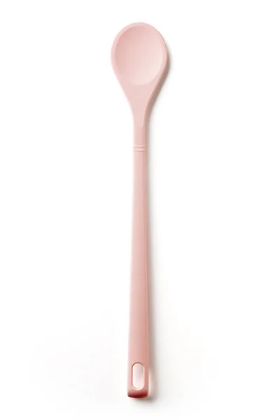 白色背景的粉红色硅胶勺 顶部视图 — 图库照片