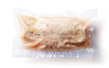 Chicken breast vacuum sealed ready for sous vide cooking isolated on white background, top view clipart