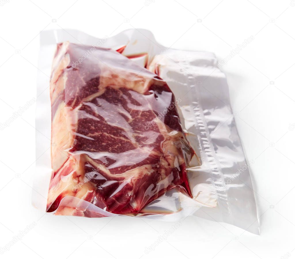 Beaf steak vacuum sealed ready for sous vide cooking isolated on white background