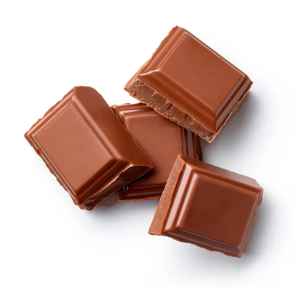 Heap Pedaços Chocolate Leite Isolado Fundo Branco Vista Superior — Fotografia de Stock