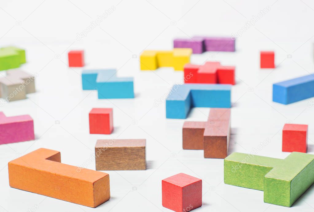 The concept of logical thinking. Mind games, psychology, the search for solutions.  Geometric shapes, tetris toy wooden blocks.