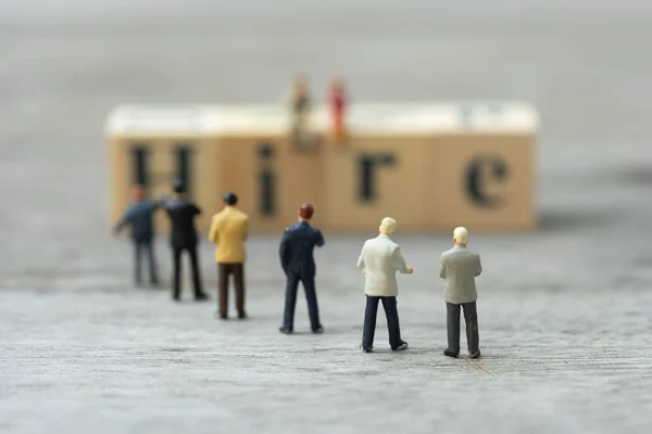 Miniature people, candidates and wooden word block \