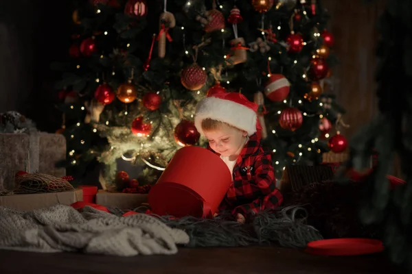 Happy Little Smiling Boy Red Pajamas Santa Hat Christmas Gift — Stock Photo, Image