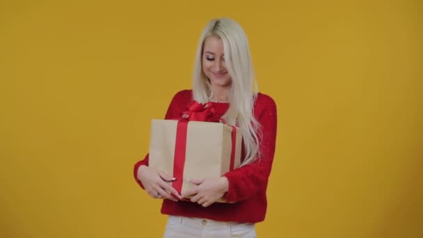 Happy Excited Young Blond Woman Gives Gift Box Red Ribbon — Stock Video