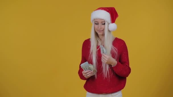 Happy Blond Woman Red Santa Hat Holding Money Banknotes Yellow — Stock Video