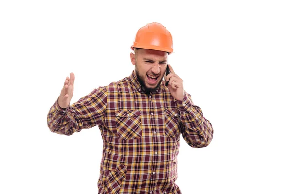 Lavoratore Arrabbiato Nervoso Con Casco Arancione Sta Parlando Forte Telefono — Foto Stock