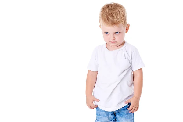 A cute little boy in a white T-shirt. The concept of promotional goods, inscriptions and drawings on clothes. Isolated on white background