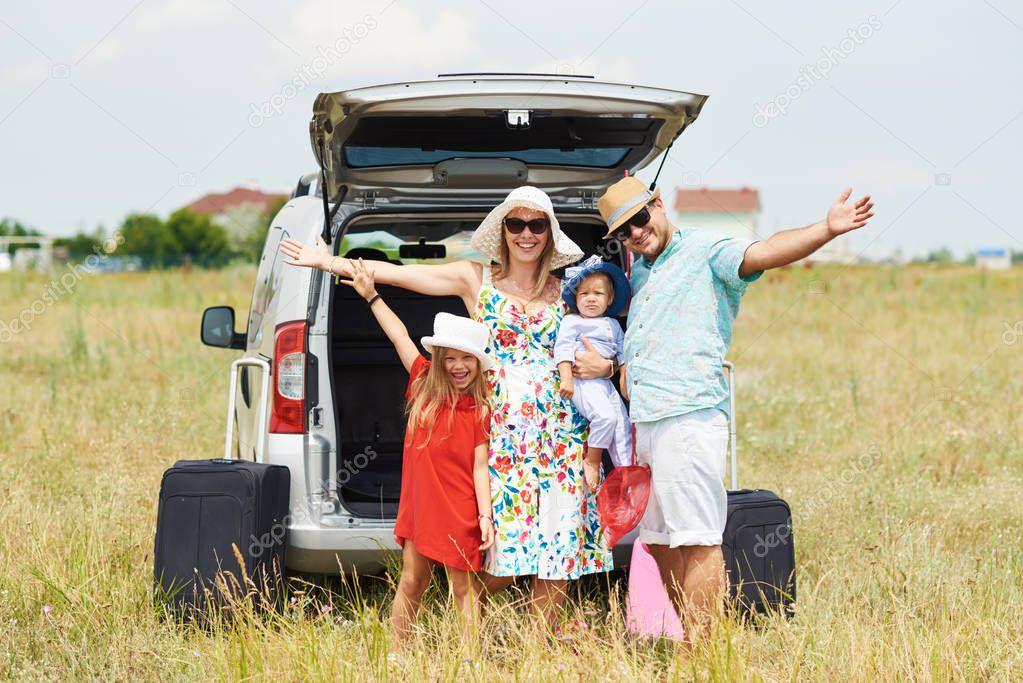 Vacation, Travel - family ready for the travel for summer vacation. suitcases and car route. People with map in hands planning road trip. travel concept. traveler. 