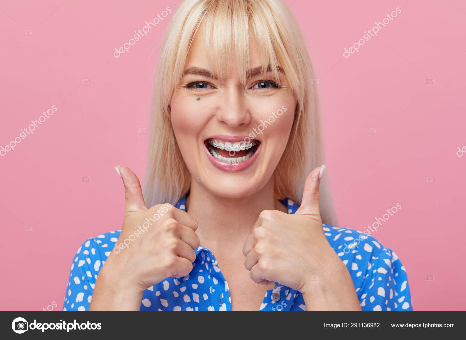 Cheerful Happy Young Woman Blonde Hair Gesturing Thumb While