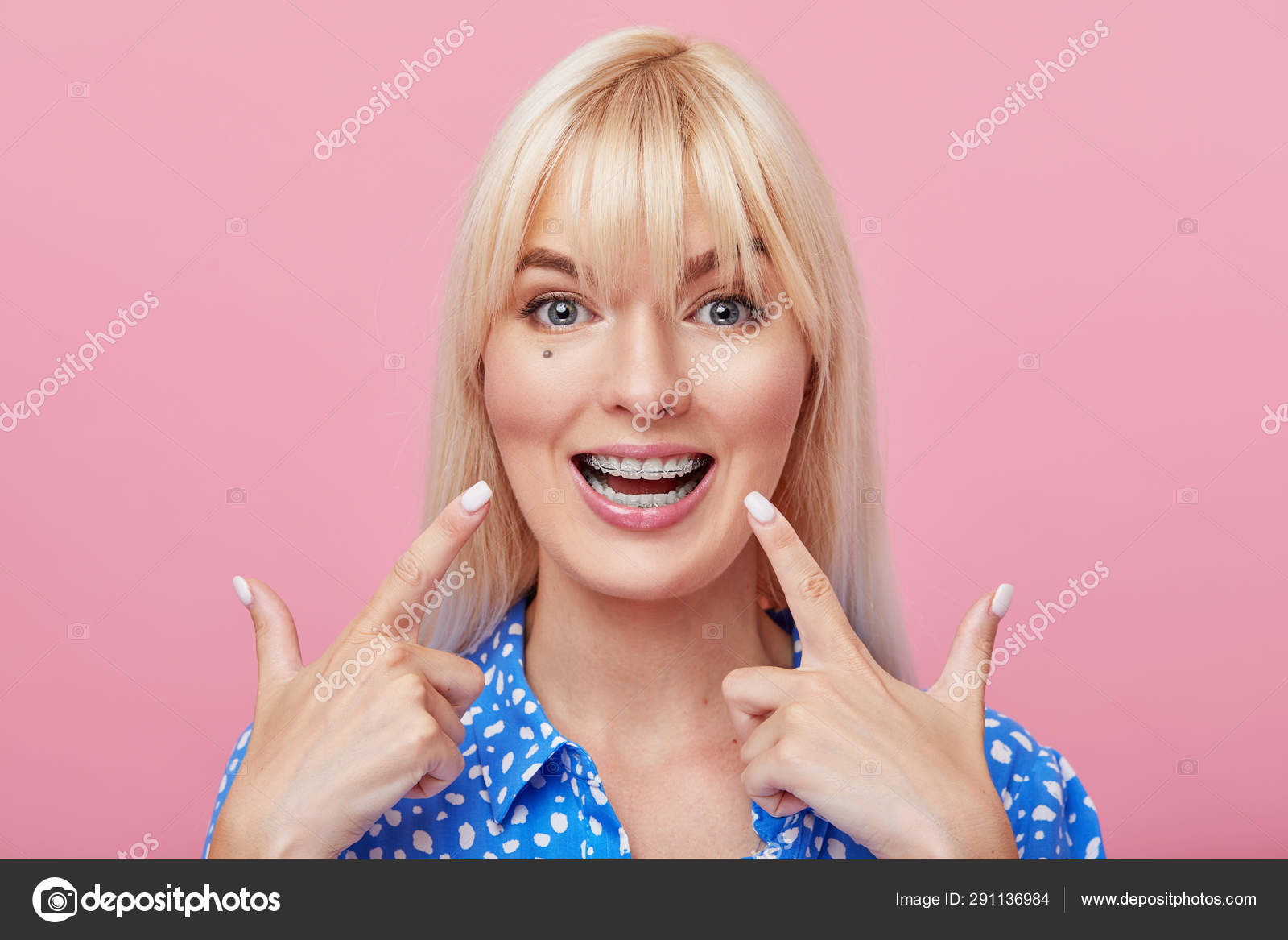 Cheerful Happy Young Woman Blonde Hair Gesturing Thumb While