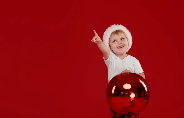 Little Kid Boy Santa Claus Hat Holds Big Christmas Ball — Stock Photo, Image