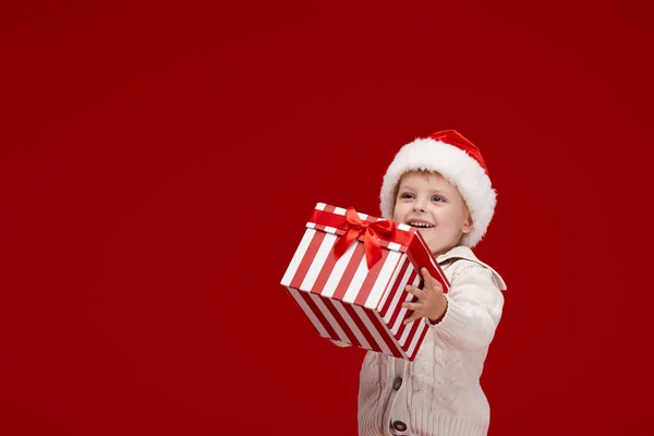 Happy Child Boy Santa Red Hat Holding Christmas Presents Gift — Stock Photo, Image