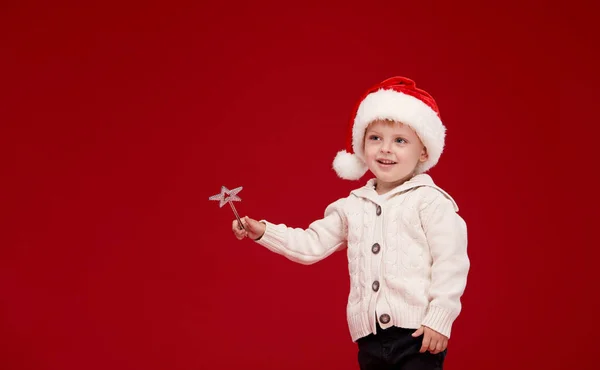 Cute Little Child Santa Hat Makes Wish Waves Magic Wand — Stock Photo, Image