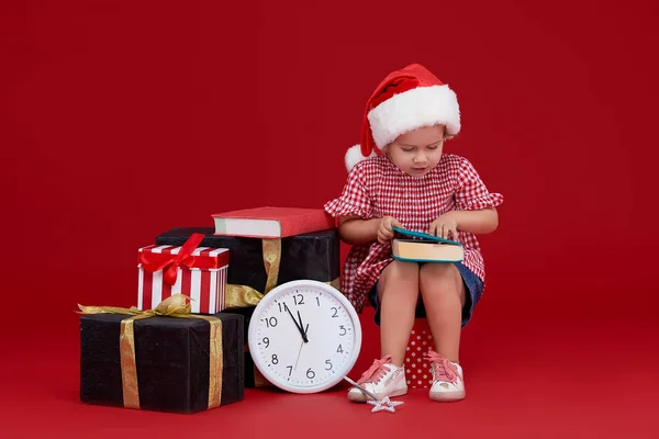 Happy Child Girl Santa Hat Gift Boxes Kid Reading Book — Stock Photo, Image