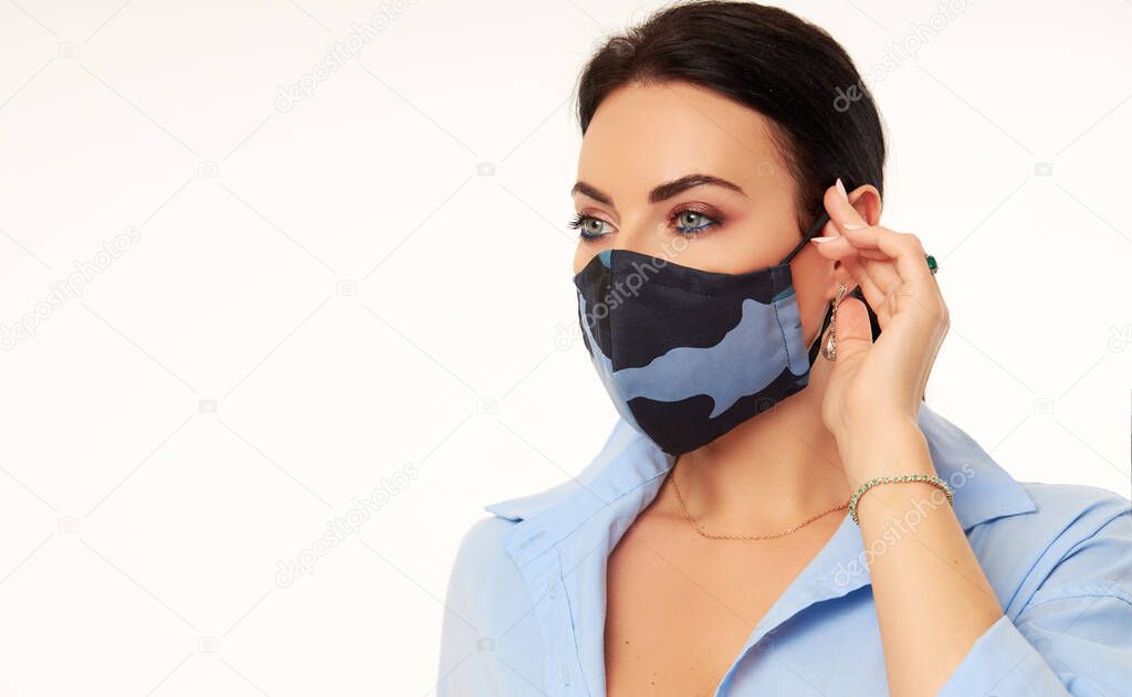 New normal concept. Woman in casual outfit during quarantine of coronavirus outbreak. Model in protective  handmade antiviral face mask on white background	