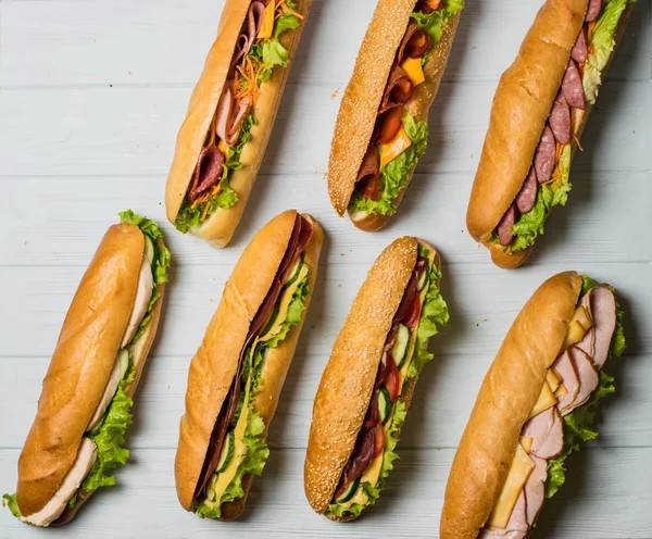 Fresh sub sandwich on white and wheat hoagies. — Stock Photo, Image